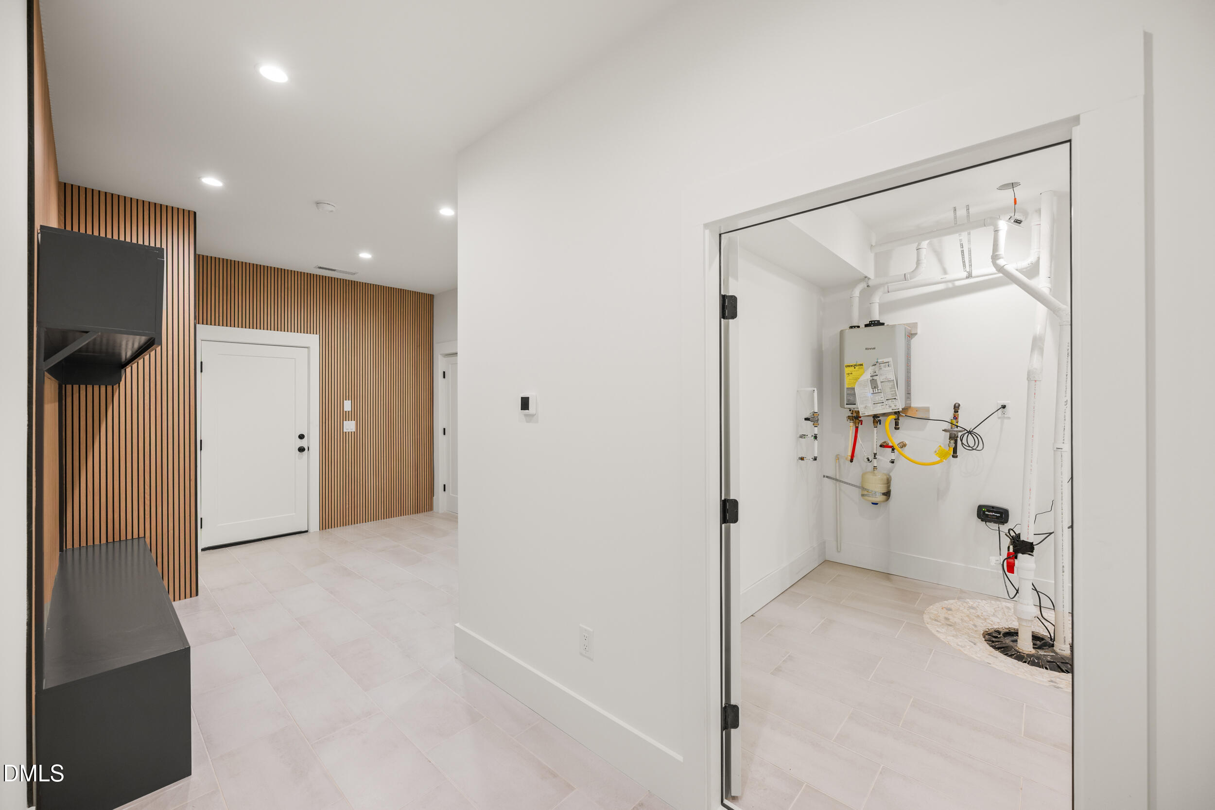 2817 Claremont Road Raleigh, NC 27608 - Photo 58 of 73 a view of a big room with closet and wooden floor