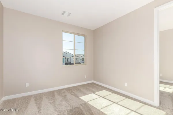a view of an empty room and window