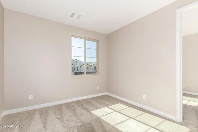 a view of an empty room and window