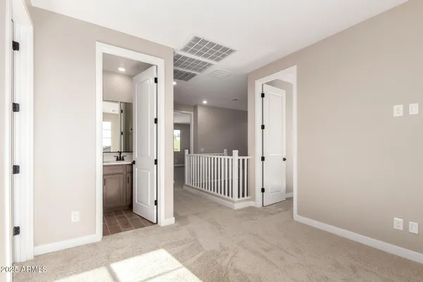 a view of a hallway with a room