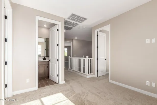 a view of a hallway with a room