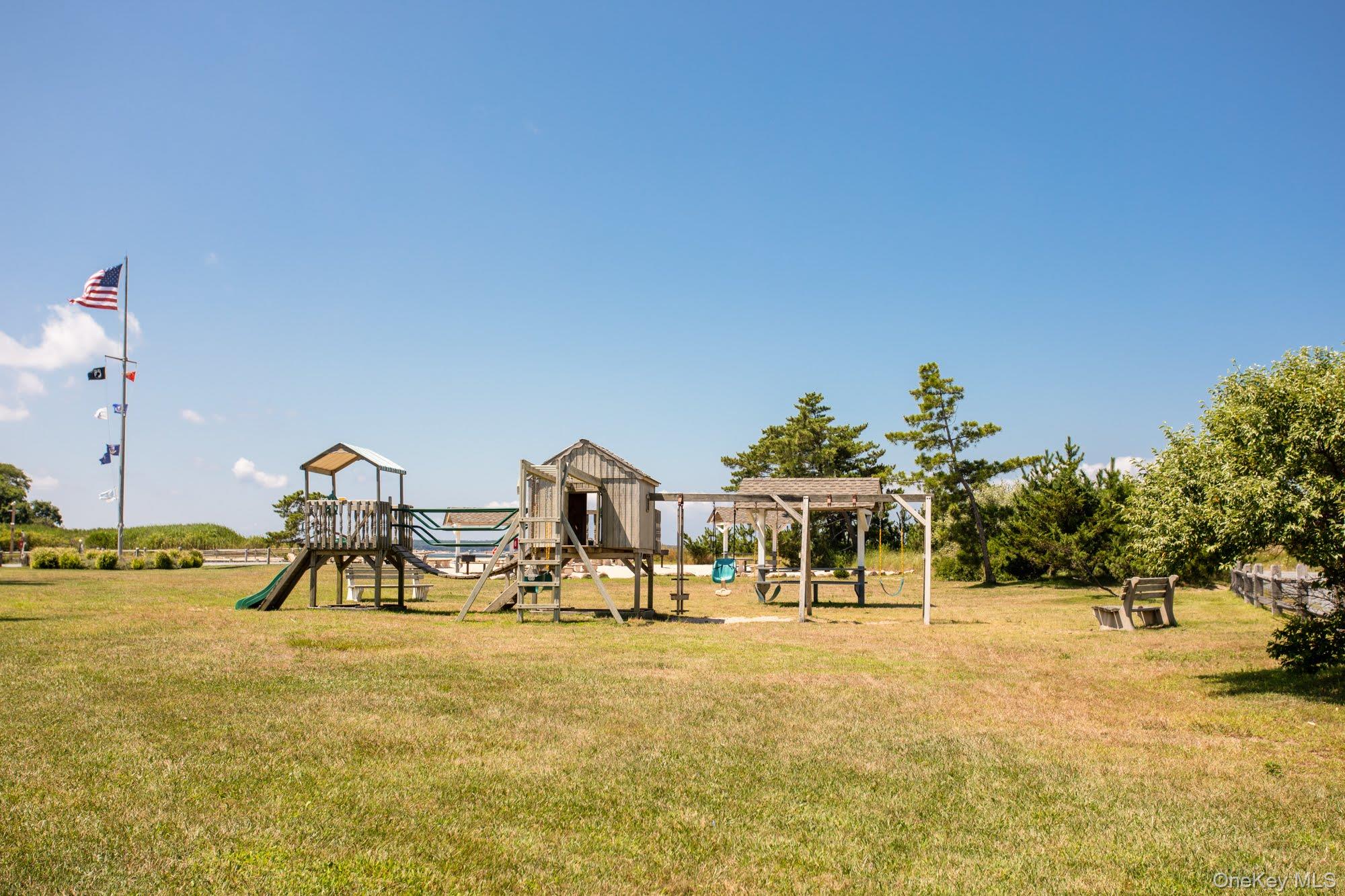 18 Norfolk Drive Springs, NY 11937 - Photo 17 of 26 a view of a park with swings and slides