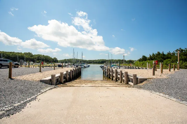 a swimming pool with outdoor seating and yard