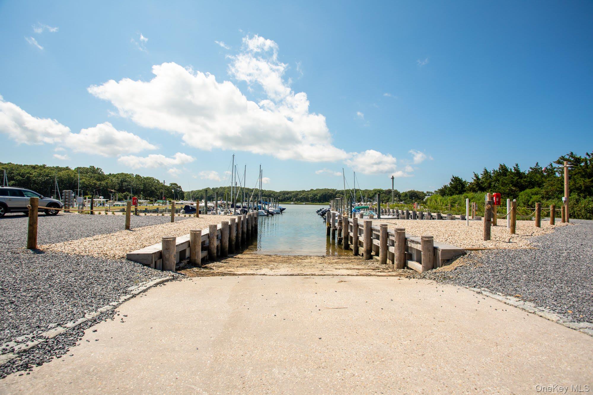 18 Norfolk Drive Springs, NY 11937 - Photo 18 of 26 a view of a terrace with a bench