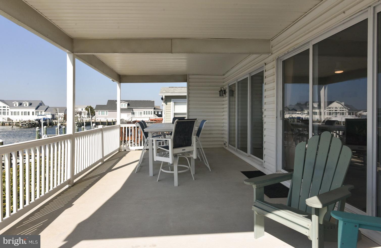 195 Pine Tree Road Ocean City, MD 21842 - Photo 6 of 60 Covered Porch Overlooking the Wide Canal
