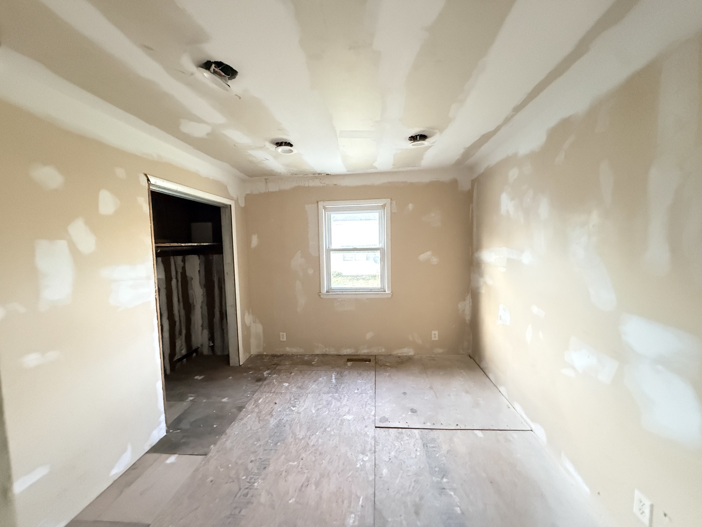 101 5th Street Carmi, IL 62821 - Photo 8 of 28 a view of empty room with wooden floor and fan