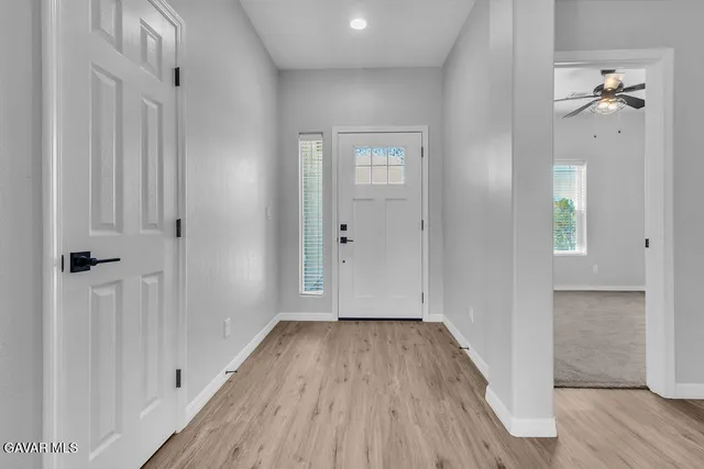 wooden floor in a hall with an entryway