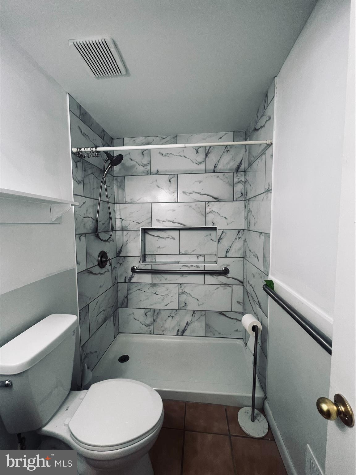 2043 Sue Avenue Baltimore, MD 21221 - Photo 16 of 26 a bathroom with a toilet and shower