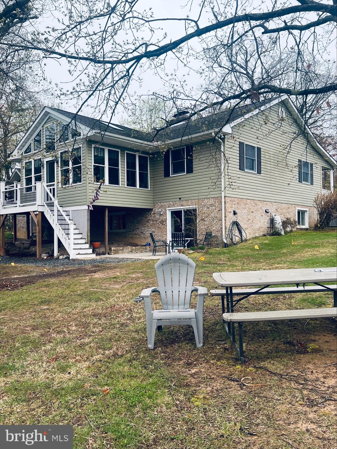 2043 Sue Avenue Baltimore, MD 21221 - Photo 23 of 26 a view of a house with a big yard couches and a fire pit