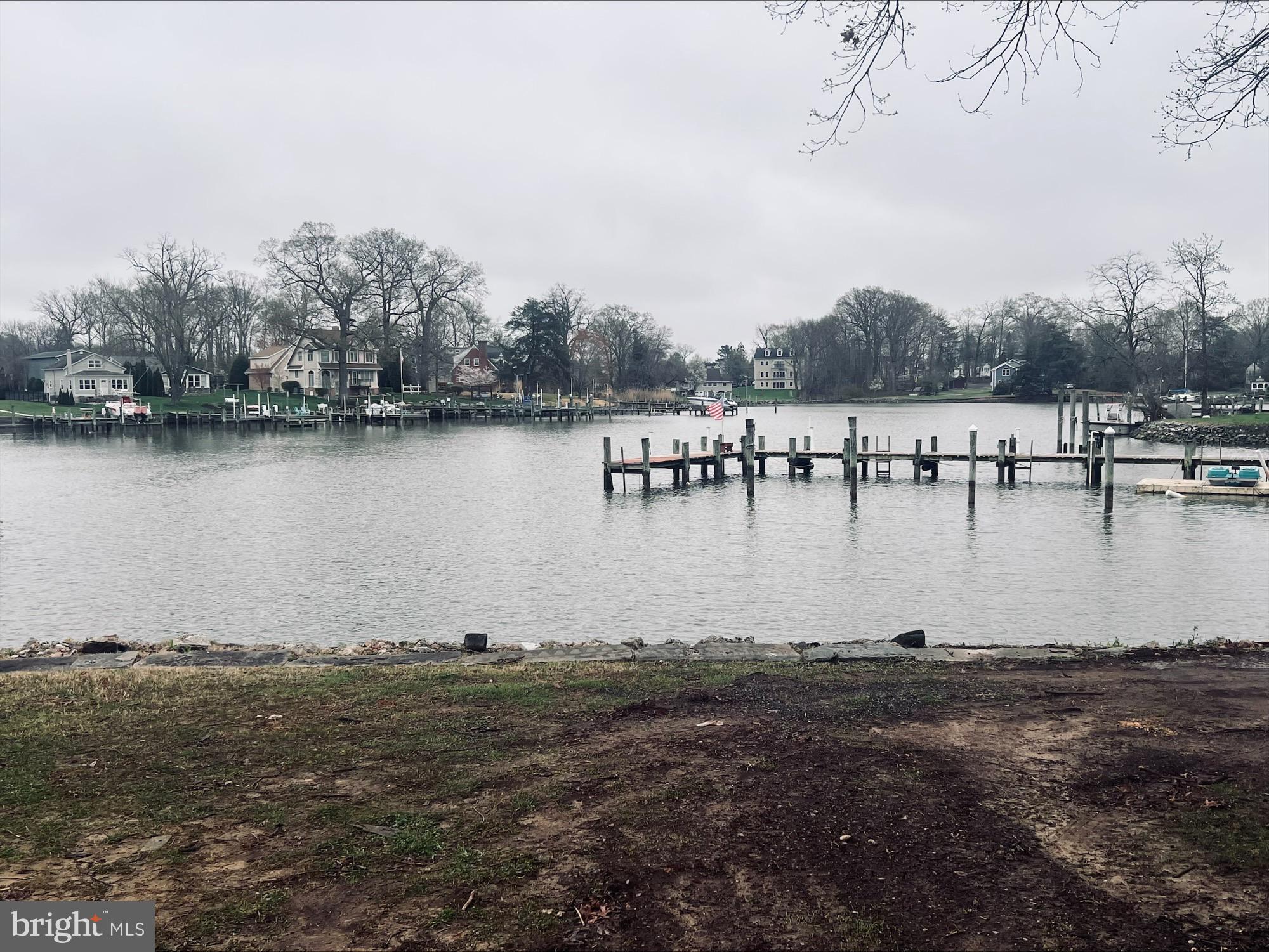 2043 Sue Avenue Baltimore, MD 21221 - Photo 25 of 26 a view of a lake with houses in the background
