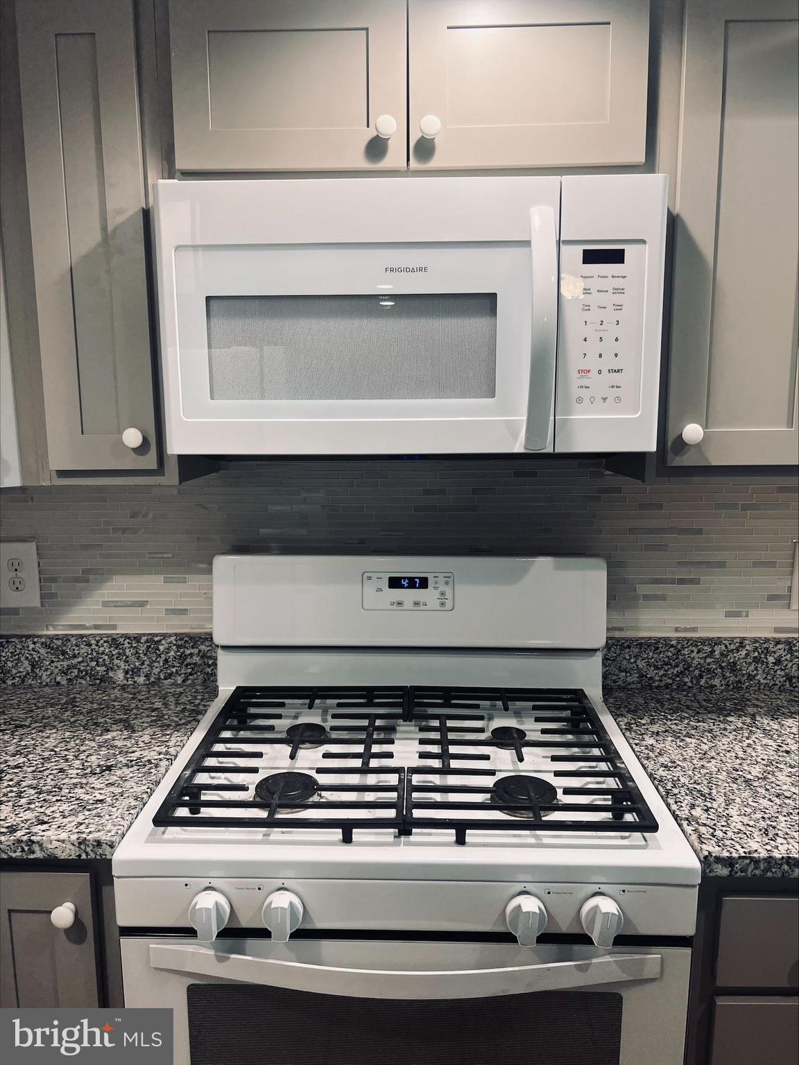 2043 Sue Avenue Baltimore, MD 21221 - Photo 7 of 26 a stove top oven sitting inside of a kitchen