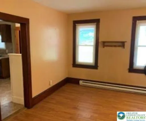a view of an empty room with a window