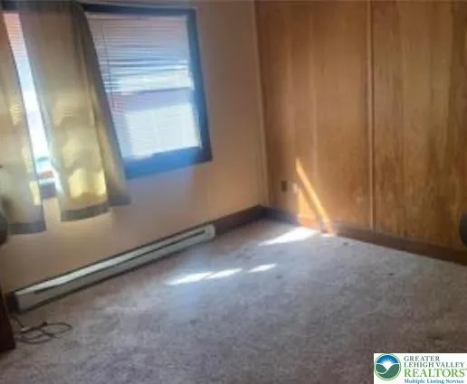 a room with a chair and a gate