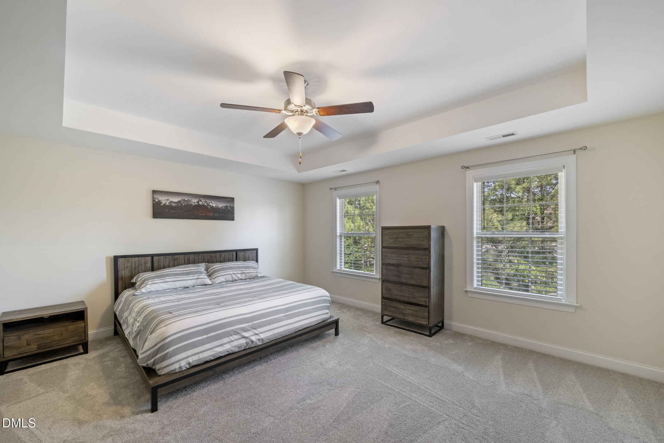 3541 Fairstone Road Wake Forest, NC 27587 - Photo 18 of 39 a spacious bedroom with a bed and a ceiling fan