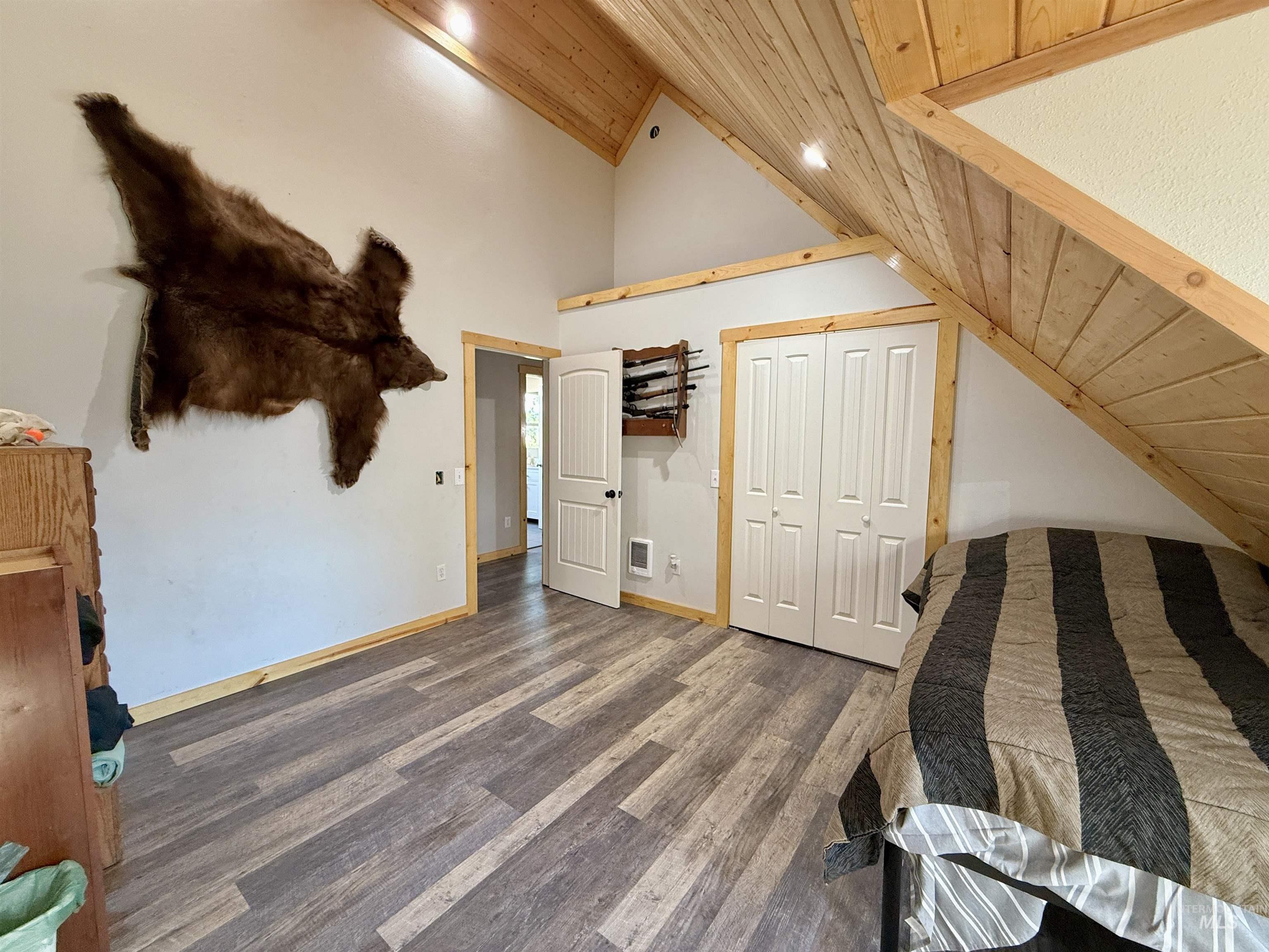 929 Mt Idaho Grade Road Grangeville, ID 83530 - Photo 20 of 47 Bedroom with wooden ceiling, wood finished floors, a closet, recessed lighting, and high vaulted ceiling