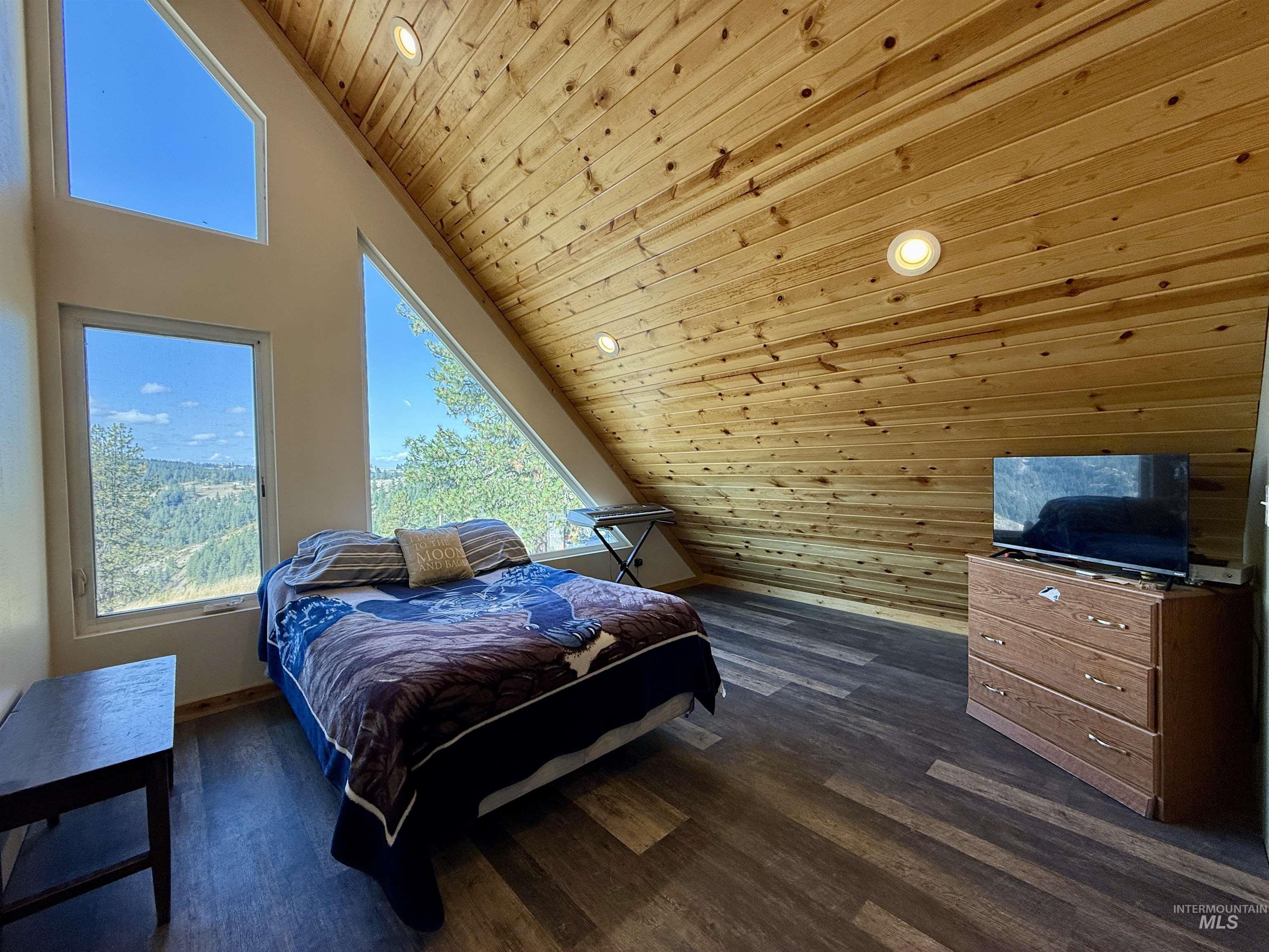 929 Mt Idaho Grade Road Grangeville, ID 83530 - Photo 22 of 47 Bedroom with wooden ceiling, dark wood-type flooring, high vaulted ceiling, and recessed lighting