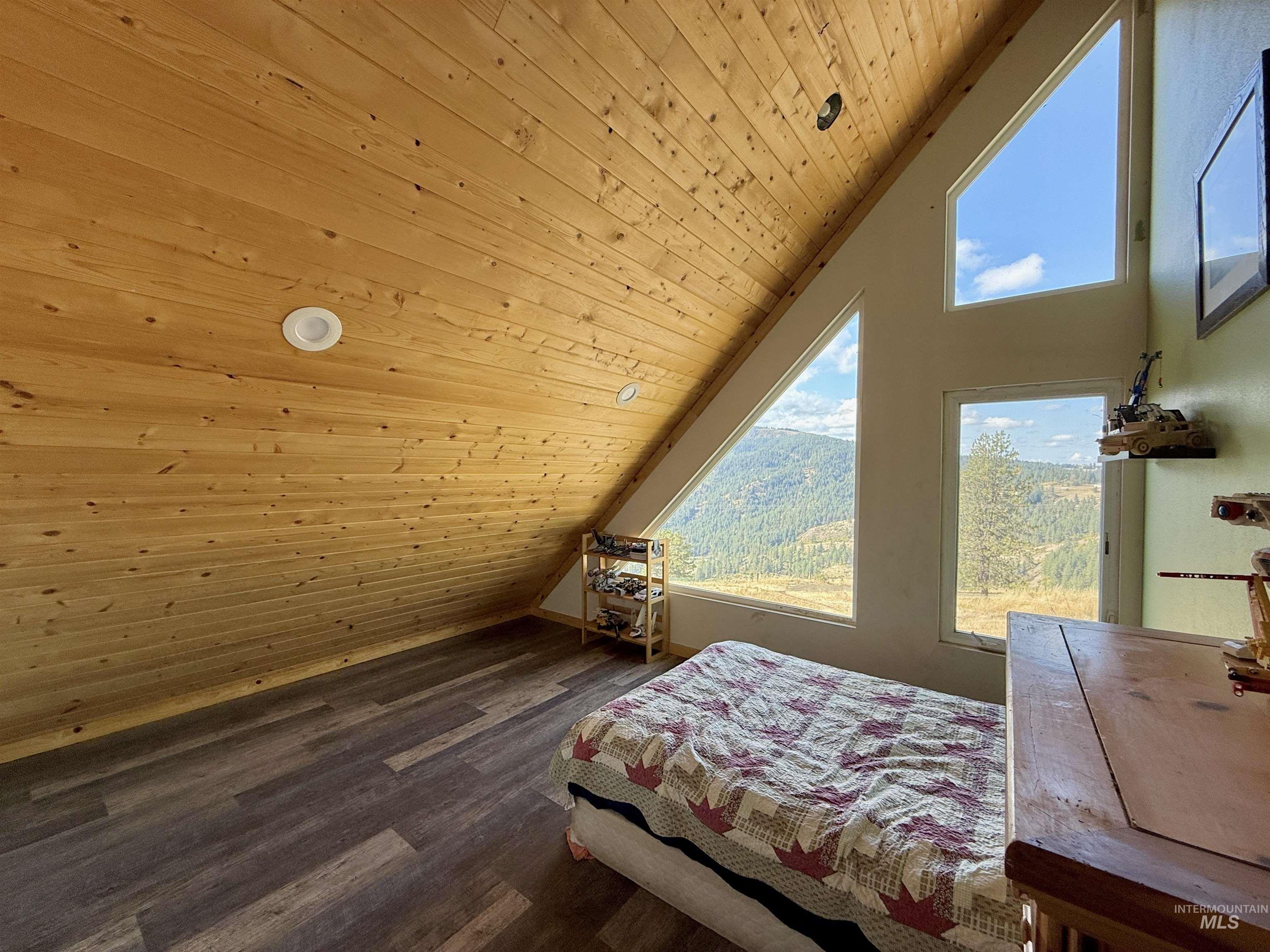 929 Mt Idaho Grade Road Grangeville, ID 83530 - Photo 24 of 47 Bedroom with lofted ceiling, wooden ceiling, and dark wood finished floors