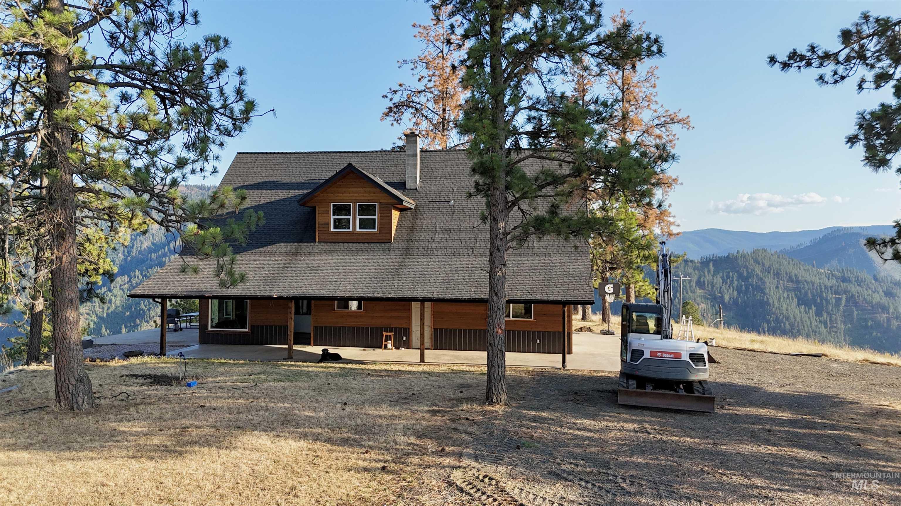 929 Mt Idaho Grade Road Grangeville, ID 83530 - Photo 26 of 47 View of front of property with a shingled roof, a porch, and a mountain view