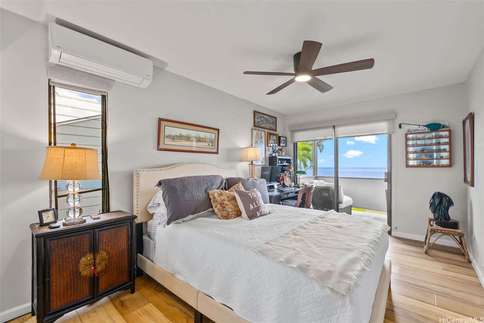 1868 Kihi Street Honolulu, HI 96821 - Photo 12 of 20 a bedroom with a bed and wooden floor