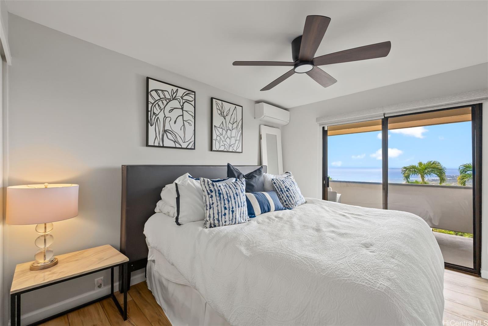 1868 Kihi Street Honolulu, HI 96821 - Photo 14 of 20 a bedroom with a bed and a lamp on table