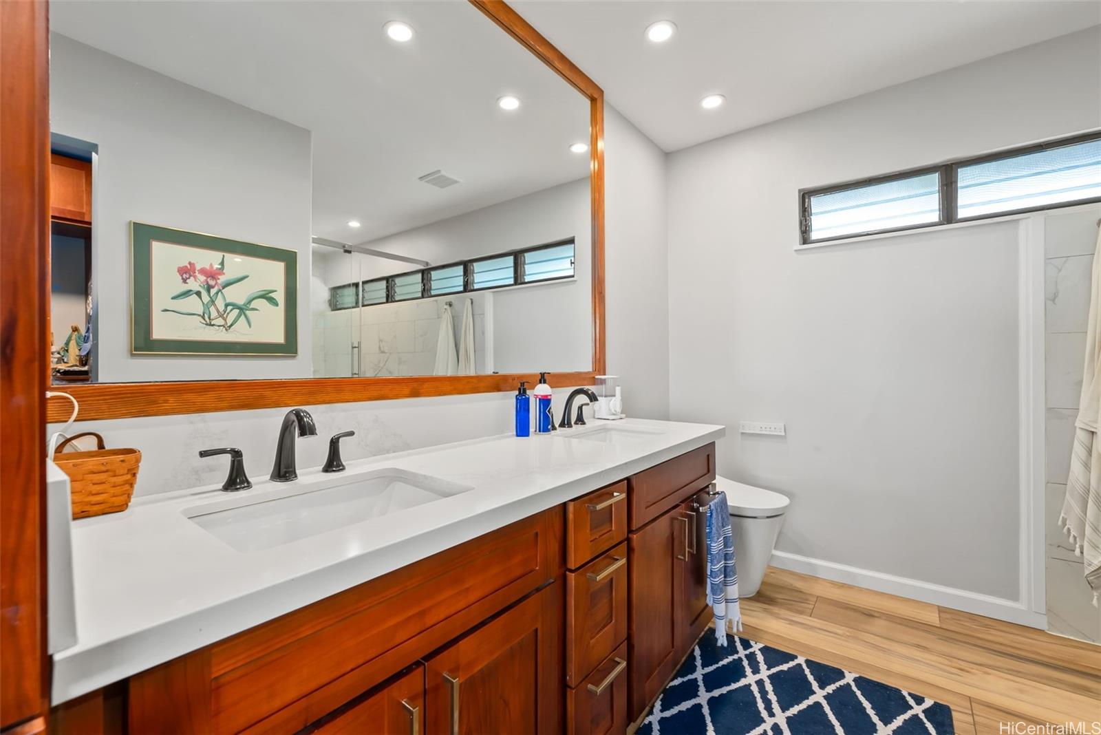 1868 Kihi Street Honolulu, HI 96821 - Photo 17 of 20 a bathroom with a sink and a mirror