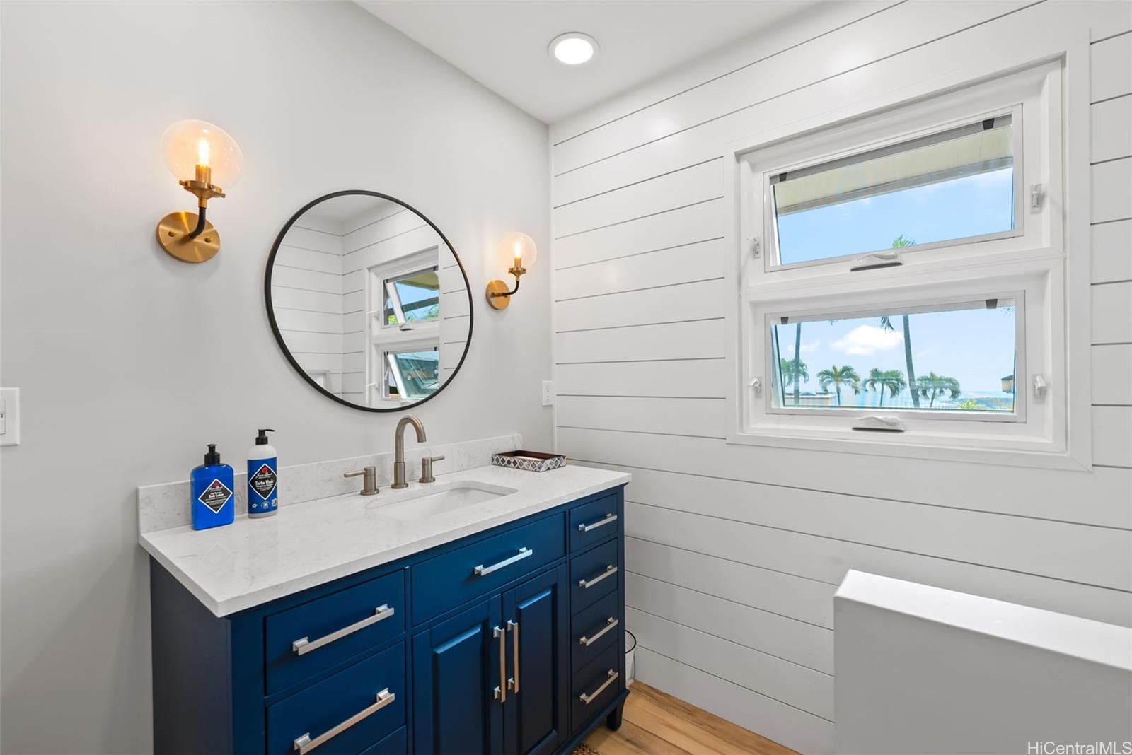1868 Kihi Street Honolulu, HI 96821 - Photo 19 of 20 a bathroom with a sink and a mirror