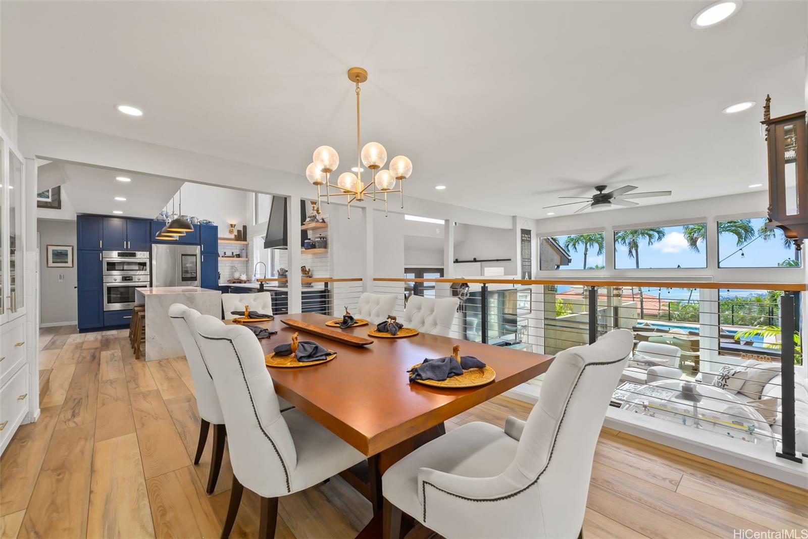 1868 Kihi Street Honolulu, HI 96821 - Photo 4 of 20 a view of a dining room and livingroom with furniture wooden floor a chandelier