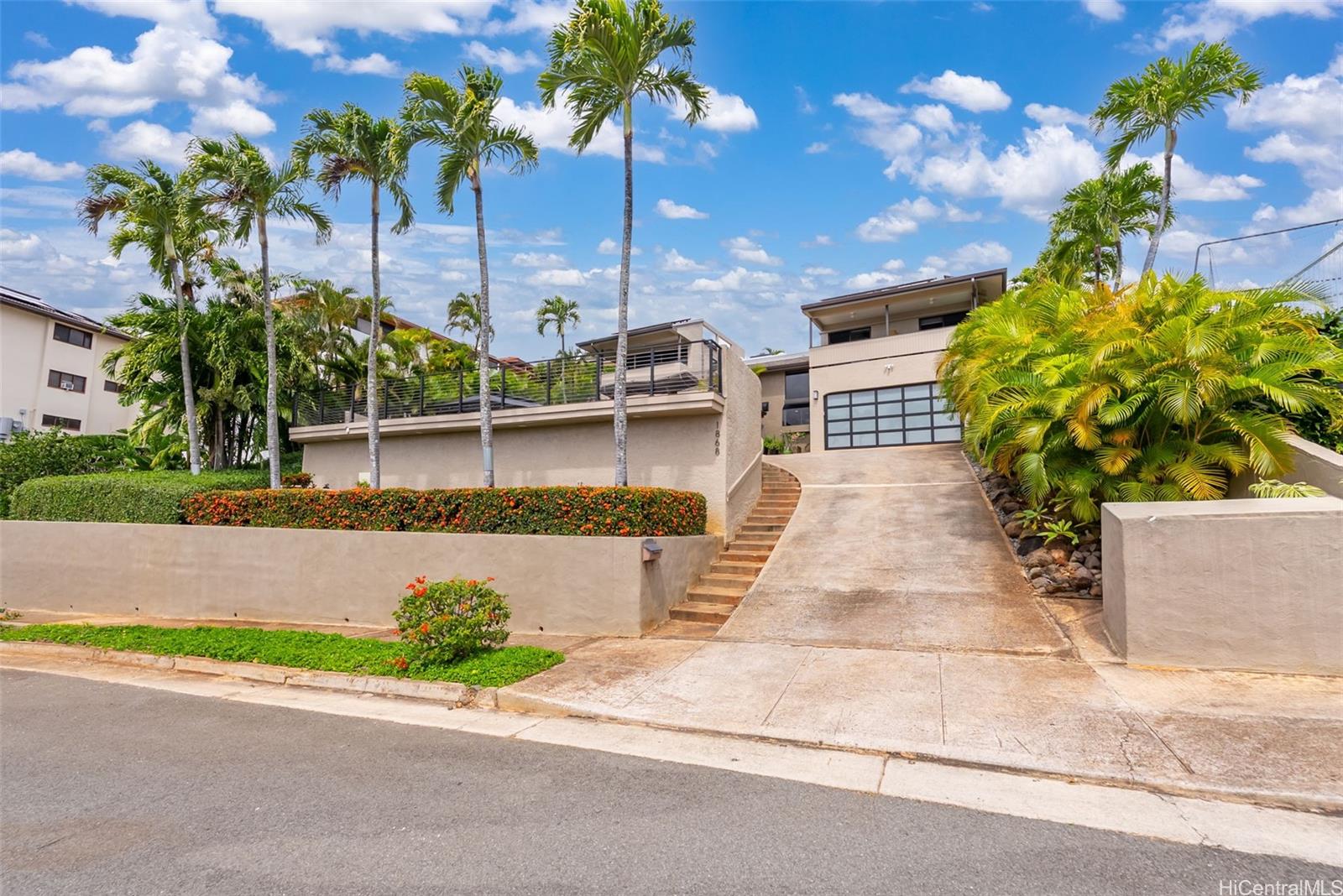 1868 Kihi Street Honolulu, HI 96821 - Photo 8 of 20 a front view of a house with a yard and outdoor seating
