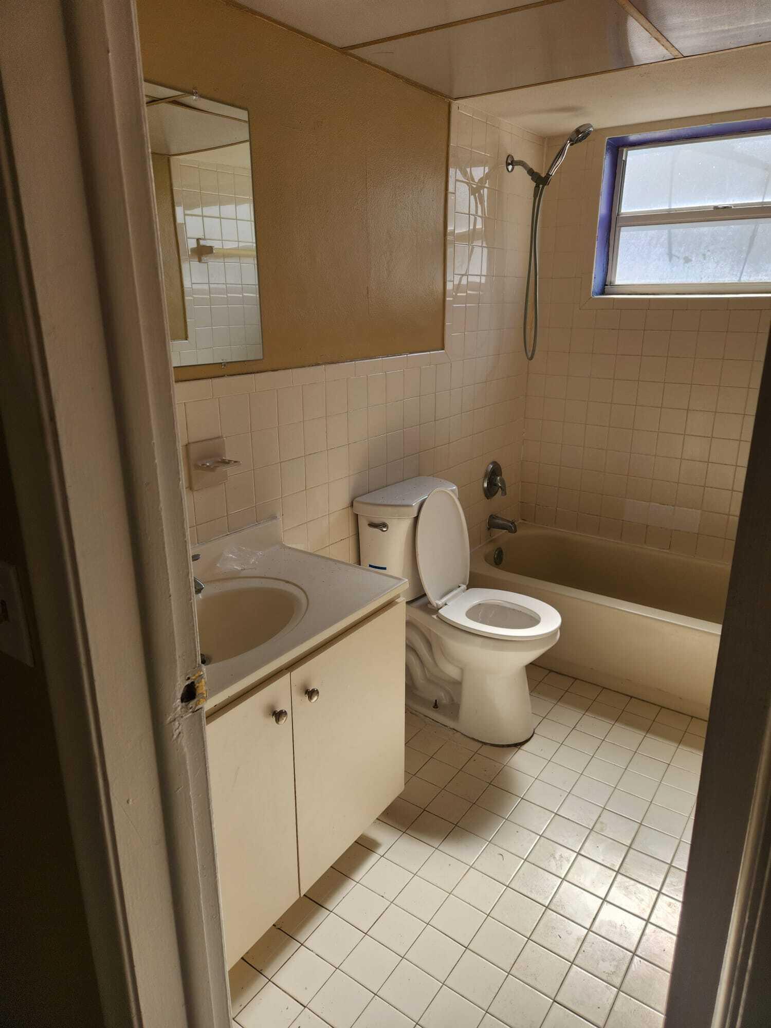 8030 Sunset Strip Sunrise, FL 33322 - Photo 7 of 8 a bathroom with a toilet and a sink