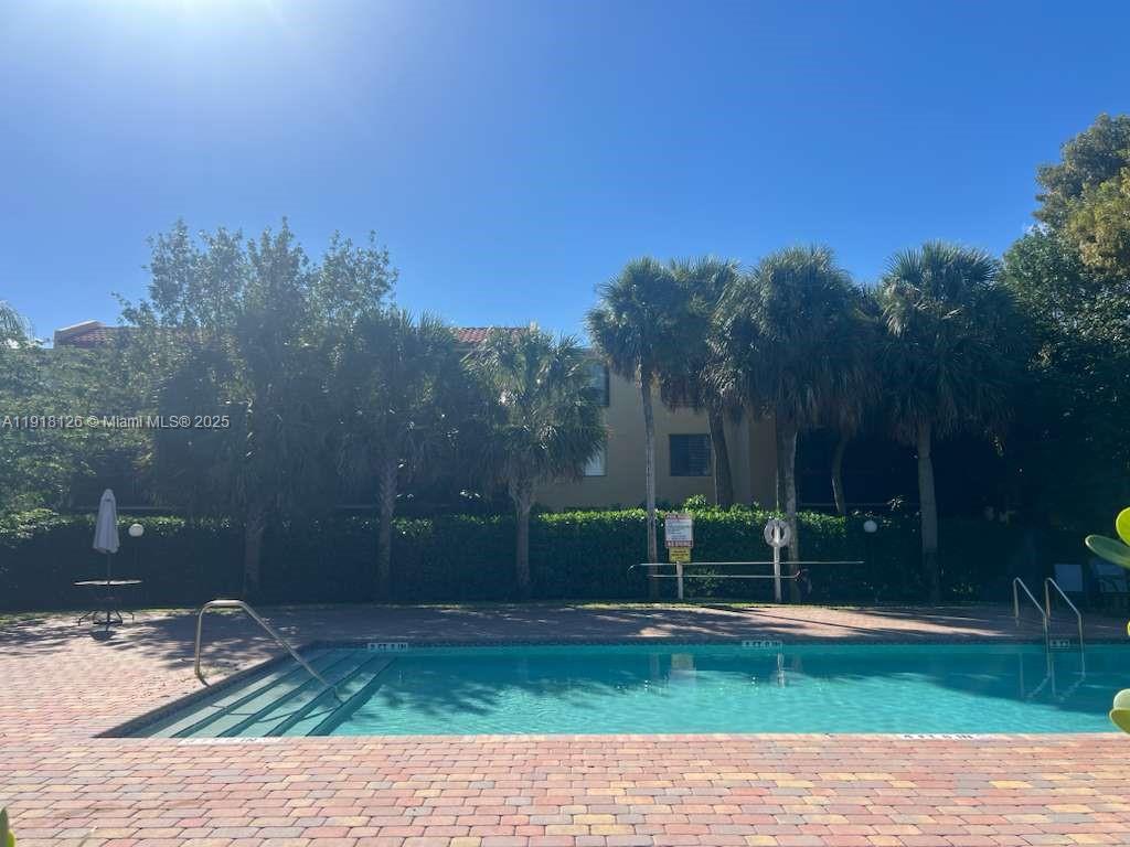 721 Southeast 1st Way, Unit B18 Deerfield Beach, FL 33441 - Photo 20 of 22 a view of a park with large trees