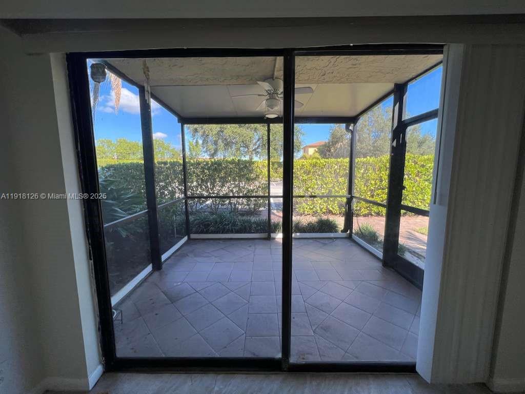 721 Southeast 1st Way, Unit B18 Deerfield Beach, FL 33441 - Photo 10 of 22 a view of an empty room with a large window