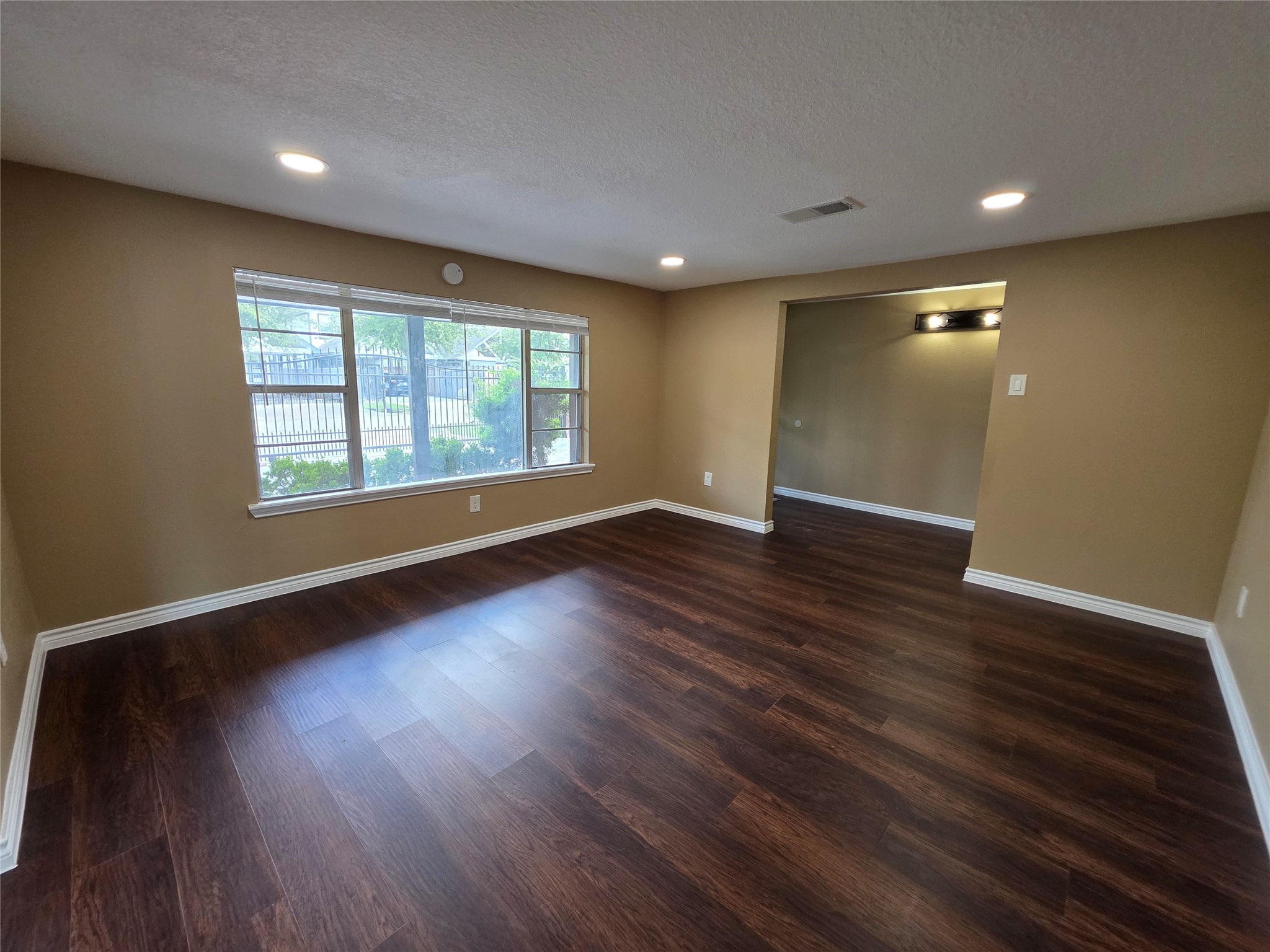 4105 Rutland Street Houston, TX 77018 - Photo 19 of 34 Formal living room area leading to the dining room space. Yes you read that right! Another living room space!