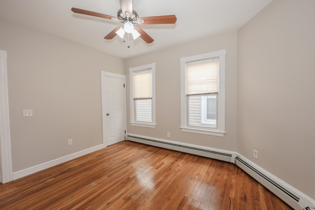 64 Bremen Street Boston, MA 02128 - Photo 17 of 42 wooden floor in an empty room with a window