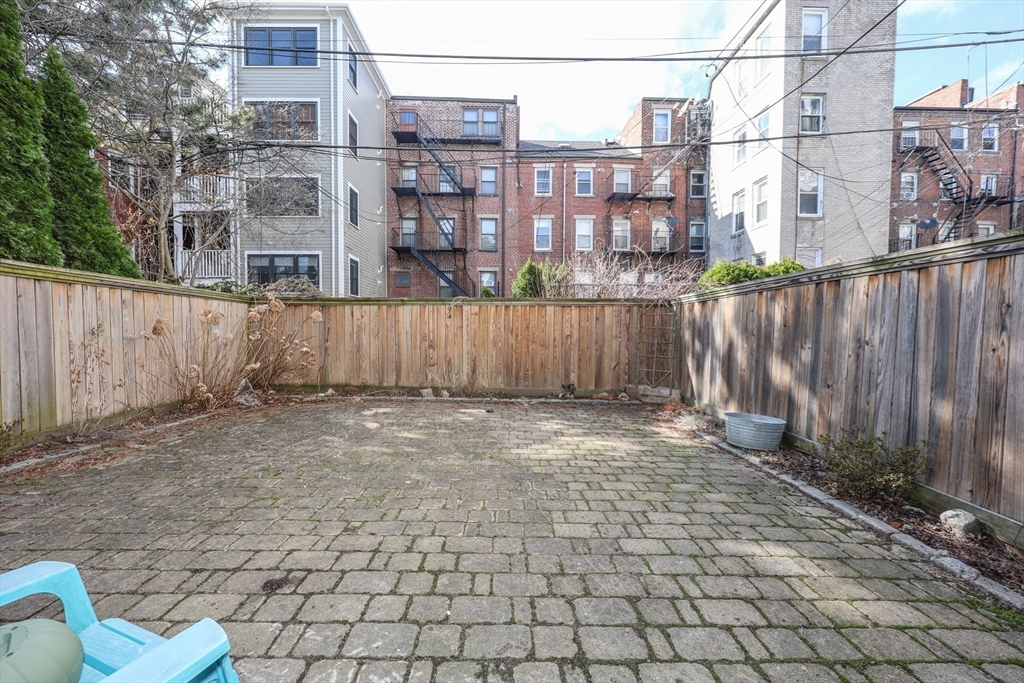64 Bremen Street Boston, MA 02128 - Photo 41 of 42 a view of a patio with wooden fence