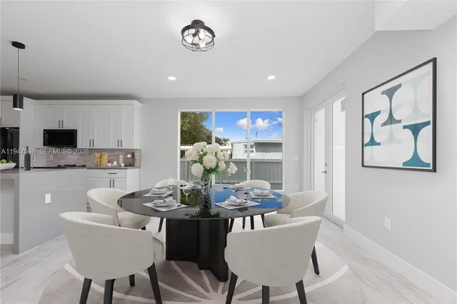 a bathroom with a bathtub shower sink vanity and toilet