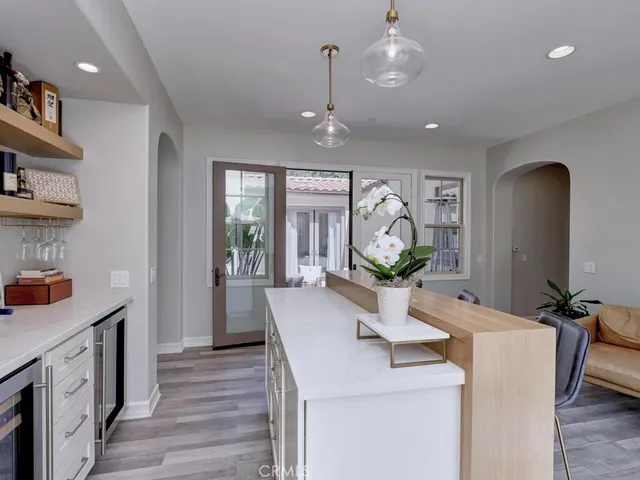 a living room with furniture a rug and a window