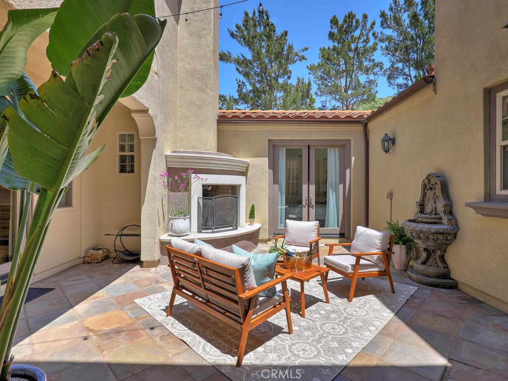 1 Lennox Court Ladera Ranch, CA 92694 - Photo 14 of 68 The central courtyard is a wonderful space year round. Doors open to many rooms, bringing the outdoors in.