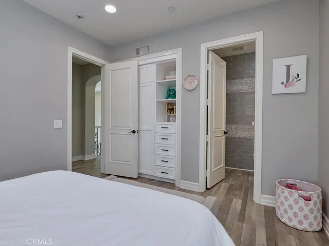 a view of a patio with a table and chairs under an umbrella
