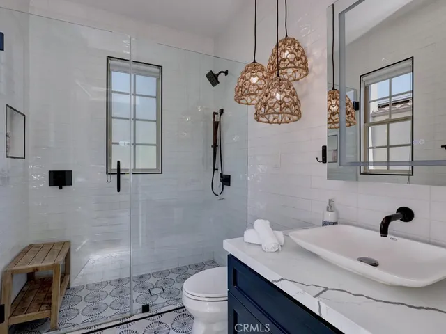a view of table and chairs under an umbrella