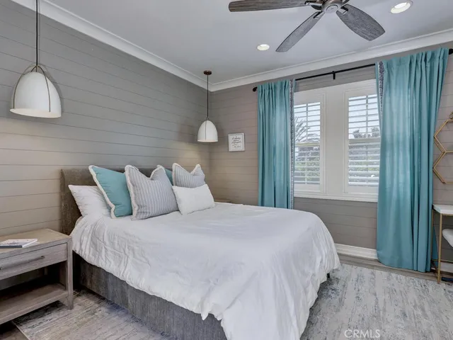 a view of table and chairs under an umbrella