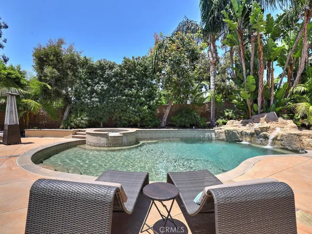 a front view of house with yard and outdoor seating