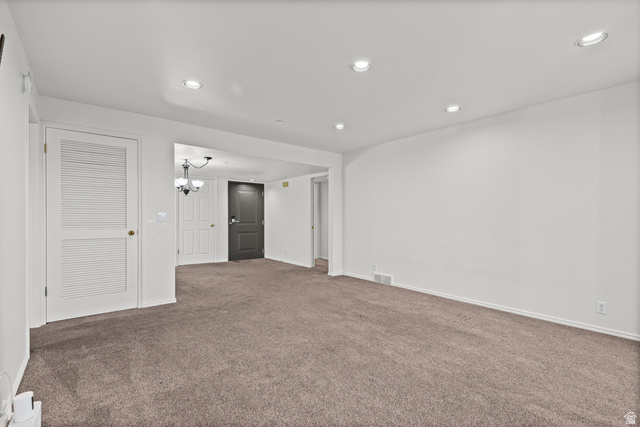 2244 North Canyon Road, Unit 212 Provo, UT 84604 - Photo 13 of 31 Spacious carpeted recreation room featuring recessed ceiling lighting, white louvered closet doors, and neutral wall finishes