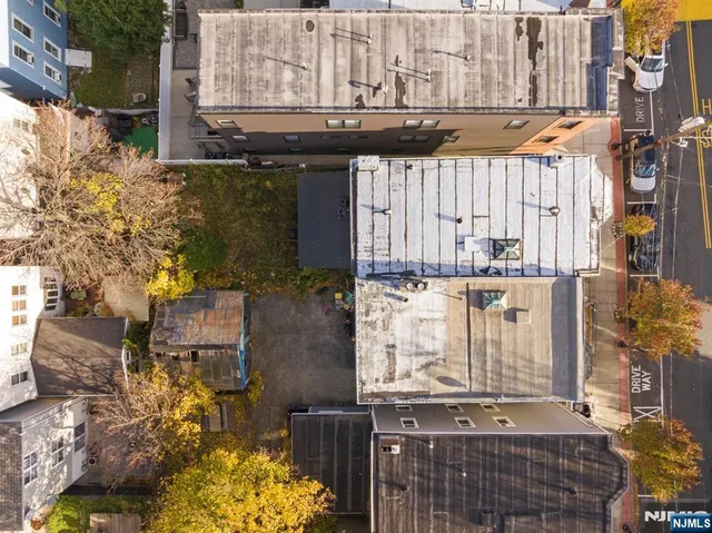 a street with buildings in the background