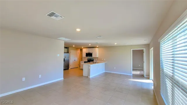 a view of a kitchen and a window