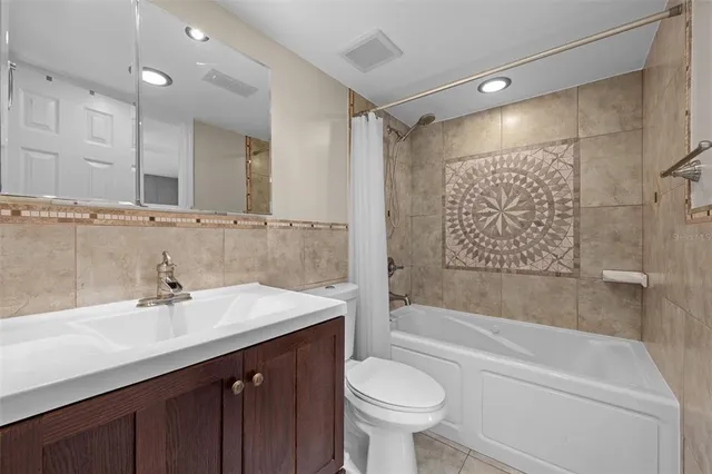 a room with lots of books and a chandelier