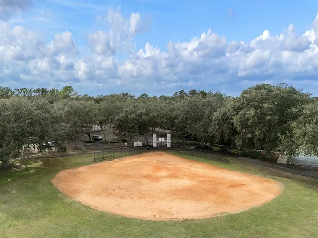 an aerial view of a house with a lake view
