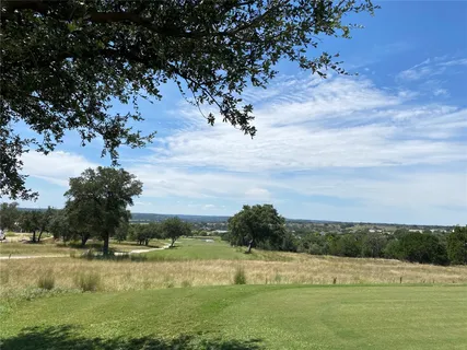 a view of a yard with an outdoor space and seating area