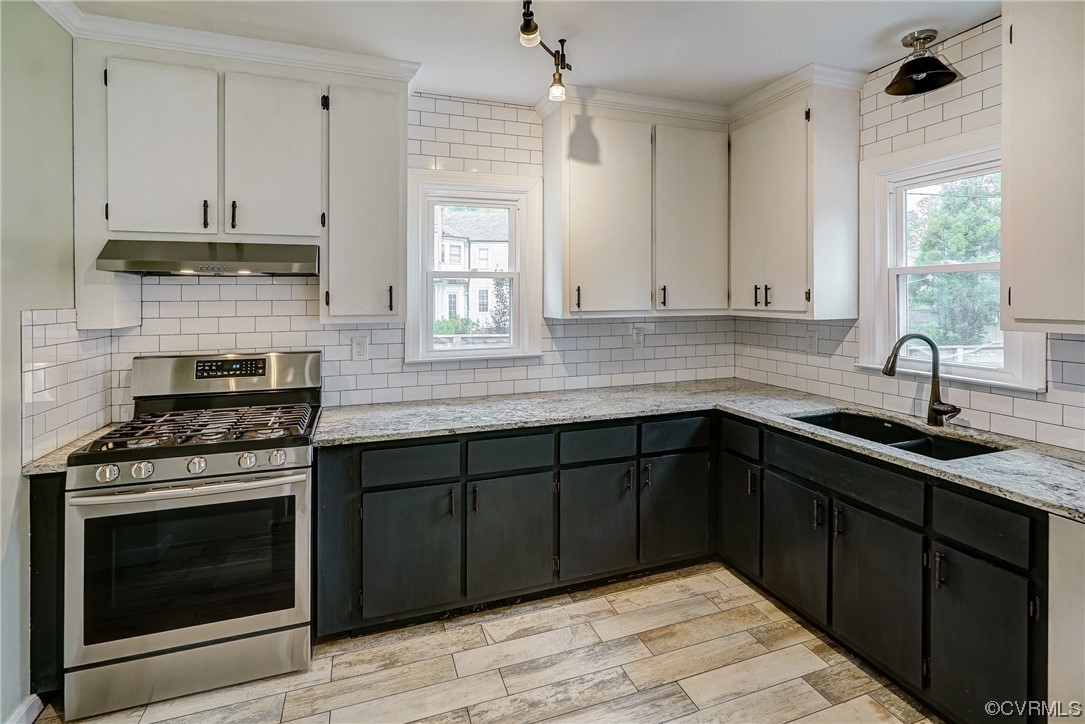 5304 Ditchley Road Richmond, VA 23226 - Photo 12 of 41 a kitchen with stainless steel appliances a stove sink and cabinets