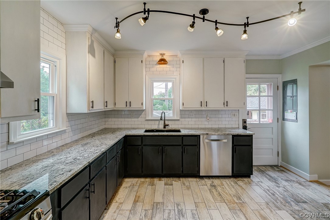 5304 Ditchley Road Richmond, VA 23226 - Photo 13 of 41 a kitchen with stainless steel appliances granite countertop a sink and stove