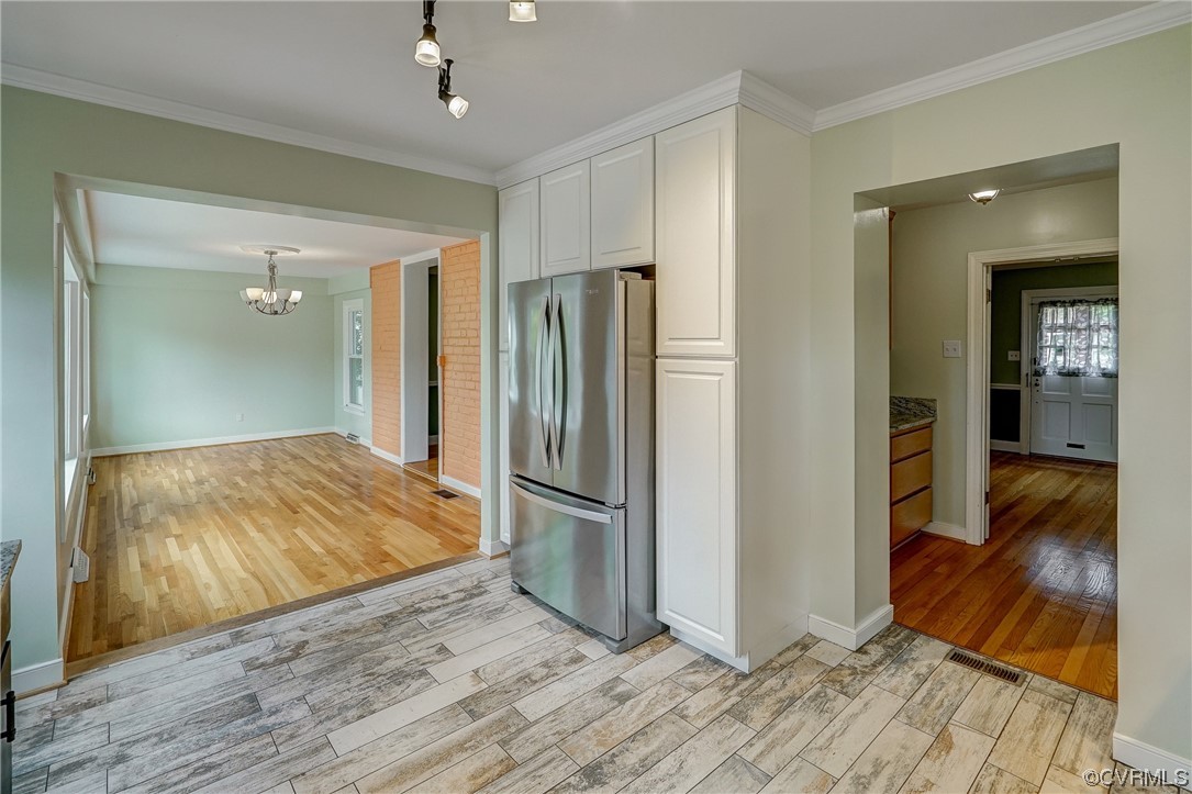 5304 Ditchley Road Richmond, VA 23226 - Photo 14 of 41 a view of a livingroom with wooden floor and a bathroom space